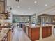Spacious kitchen featuring a large island with seating, stainless steel appliances, and open concept design at 5812 W Spur Dr, Phoenix, AZ 85083
