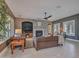 Neutral living room boasts beautiful stone fireplace, large windows with shutters, and plush furnishings at 5812 W Spur Dr, Phoenix, AZ 85083
