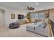 Open loft area featuring a large sectional sofa and stylish furnishings at 5812 W Spur Dr, Phoenix, AZ 85083