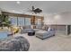 Open loft area with a large gray sectional sofa and plush carpeting at 5812 W Spur Dr, Phoenix, AZ 85083