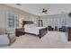 This elegant main bedroom offers generous space, neutral colors, and plantation shutters at 5812 W Spur Dr, Phoenix, AZ 85083