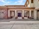 Arched porte-cochere leading to courtyard, providing shade and architectural detail to the home at 5812 W Spur Dr, Phoenix, AZ 85083