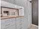 Closet offers ample storage with white cabinetry, drawers, and a light wood countertop at 5812 W Spur Dr, Phoenix, AZ 85083