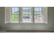 This window showcases gorgeous mountain views and well-manicured lawns of this beautiful neighborhood at 5812 W Spur Dr, Phoenix, AZ 85083