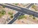 Aerial view of neighborhood with native vegetation, open roads and mountain views at 6202 W Maya Dr, Phoenix, AZ 85083