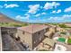 Expansive backyard featuring a pool, a covered patio, and a built-in grill, perfect for outdoor living and entertaining at 6202 W Maya Dr, Phoenix, AZ 85083