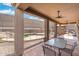 Covered outdoor kitchen and dining area offer great views of the fenced pool and surrounding yard at 6202 W Maya Dr, Phoenix, AZ 85083