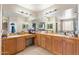 Large bathroom features a double sink vanity, lots of counter space, and a large mirror at 6202 W Maya Dr, Phoenix, AZ 85083