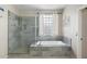 Well-lit bathroom featuring separate shower and tub at 6202 W Maya Dr, Phoenix, AZ 85083