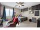 Bedroom featuring a ceiling fan and decorated with school mementos at 6202 W Maya Dr, Phoenix, AZ 85083