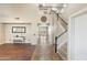 Spacious entryway with tiled floors, staircase, and view into the home's living spaces at 6202 W Maya Dr, Phoenix, AZ 85083