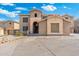 Two-story home featuring stone accents, archway entrance, desert landscaping, and a spacious concrete driveway at 6202 W Maya Dr, Phoenix, AZ 85083