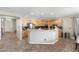 Spacious kitchen with granite countertops, wooden cabinets, and ample counter space at 6202 W Maya Dr, Phoenix, AZ 85083