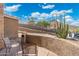 Outdoor patio featuring desert landscaping, mountain views, stucco walls, and patio seating area at 6202 W Maya Dr, Phoenix, AZ 85083