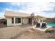 Backyard view showcases patio area, desert landscaping, and inviting swimming pool at 6366 W Saint John Ave, Glendale, AZ 85308