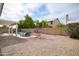 Landscaped backyard featuring a pool, a patio, and a rock covered lawn, perfect for outdoor relaxation and entertainment at 6366 W Saint John Ave, Glendale, AZ 85308