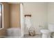 Bright bathroom featuring tiled shower, convenient toilet, and ample counter space for a refreshing and functional design at 6366 W Saint John Ave, Glendale, AZ 85308