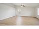 Spacious bedroom with modern flooring, neutral walls, ceiling fan and a bright, airy atmosphere at 6366 W Saint John Ave, Glendale, AZ 85308