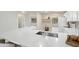 Gourmet kitchen with a deep stainless sink and white quartz countertops at 6366 W Saint John Ave, Glendale, AZ 85308