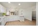 Bright kitchen featuring a peninsula, modern appliances, and luxury stone countertops at 6366 W Saint John Ave, Glendale, AZ 85308