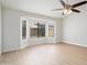 Bright room boasts vaulted ceilings, fan, and a large window overlooking the front yard at 6366 W Saint John Ave, Glendale, AZ 85308