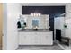 Elegant bathroom showcasing double sinks, a framed mirror, and a modern shower with a glass door at 651 N Ironwood Dr # 8, Apache Junction, AZ 85120