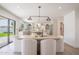 Bright dining room with modern light fixture, a backyard view, and an open floor plan at 6529 E Eugie Ter, Scottsdale, AZ 85254