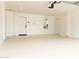 Spacious and clean garage with white epoxy flooring, ample storage, and a water heater at 6529 E Eugie Ter, Scottsdale, AZ 85254