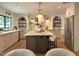 Elegant kitchen featuring a large island, stainless steel appliances, and custom cabinetry at 6529 E Eugie Ter, Scottsdale, AZ 85254