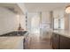 Gourmet kitchen featuring stainless steel appliances, a gas range, and custom white cabinetry at 6529 E Eugie Ter, Scottsdale, AZ 85254