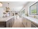 Open kitchen with a large island, stylish fixtures, and a seamless transition to the living area at 6529 E Eugie Ter, Scottsdale, AZ 85254