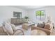 Comfortable living room with stylish decor, natural light, and wood-style flooring at 6529 E Eugie Ter, Scottsdale, AZ 85254