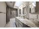 Bathroom with double sink vanity, granite countertop, and tiled shower and tub combo at 6533 N 7Th Ave # 18, Phoenix, AZ 85013