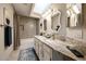 Updated bathroom featuring double sinks with granite countertops, and modern fixtures at 6533 N 7Th Ave # 18, Phoenix, AZ 85013
