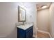 Bathroom with blue vanity and marble countertop, decorative mirror and modern sink at 6533 N 7Th Ave # 18, Phoenix, AZ 85013