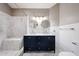 Beautiful bathroom features a double sink vanity and marble tiled shower at 6533 N 7Th Ave # 18, Phoenix, AZ 85013