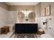 Elegant bathroom featuring double sinks, marble countertop, white tiled shower, and gold fixtures at 6533 N 7Th Ave # 18, Phoenix, AZ 85013