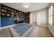 This flex space is great for bedroom, office, or playroom with built-in shelves and lots of light at 6533 N 7Th Ave # 18, Phoenix, AZ 85013
