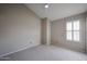 Neutral bedroom with carpeted floors and a window with shutters at 6533 N 7Th Ave # 18, Phoenix, AZ 85013