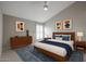 Stylish bedroom with a wooden bed frame, a blue accent rug, and ample natural light at 6533 N 7Th Ave # 18, Phoenix, AZ 85013
