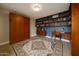 A stylish bedroom with custom shelving, study desk, and luxury Murphy bed for flexible living at 6533 N 7Th Ave # 18, Phoenix, AZ 85013