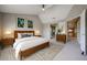 Bright bedroom with a wooden bed frame, ceiling fan, and neutral decor for a calm retreat at 6533 N 7Th Ave # 18, Phoenix, AZ 85013