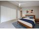 Well-lit bedroom featuring a ceiling fan and a closet for storage at 6533 N 7Th Ave # 18, Phoenix, AZ 85013