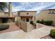 Inviting condo with red tile roof, stucco walls, gated courtyard, and tidy landscaping at 6533 N 7Th Ave # 18, Phoenix, AZ 85013