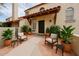 Inviting front entrance with stylish seating area and desert landscaping creates a warm welcome at 6533 N 7Th Ave # 18, Phoenix, AZ 85013