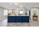 Gourmet kitchen with a large blue island with marble countertop and luxury appliances, ideal for entertaining at 6533 N 7Th Ave # 18, Phoenix, AZ 85013