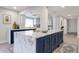 Modern kitchen features a large island with marble counters and lots of storage for cooking needs at 6533 N 7Th Ave # 18, Phoenix, AZ 85013