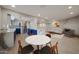 Open concept living room with modern kitchen, dining area, comfortable seating, and stylish decor at 6533 N 7Th Ave # 18, Phoenix, AZ 85013