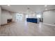 Open-plan room with fireplace, kitchen island and access to the backyard at 6533 N 7Th Ave # 18, Phoenix, AZ 85013