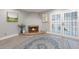 Cozy living room with fireplace and French doors, perfect for relaxing or entertaining guests at 6533 N 7Th Ave # 18, Phoenix, AZ 85013
